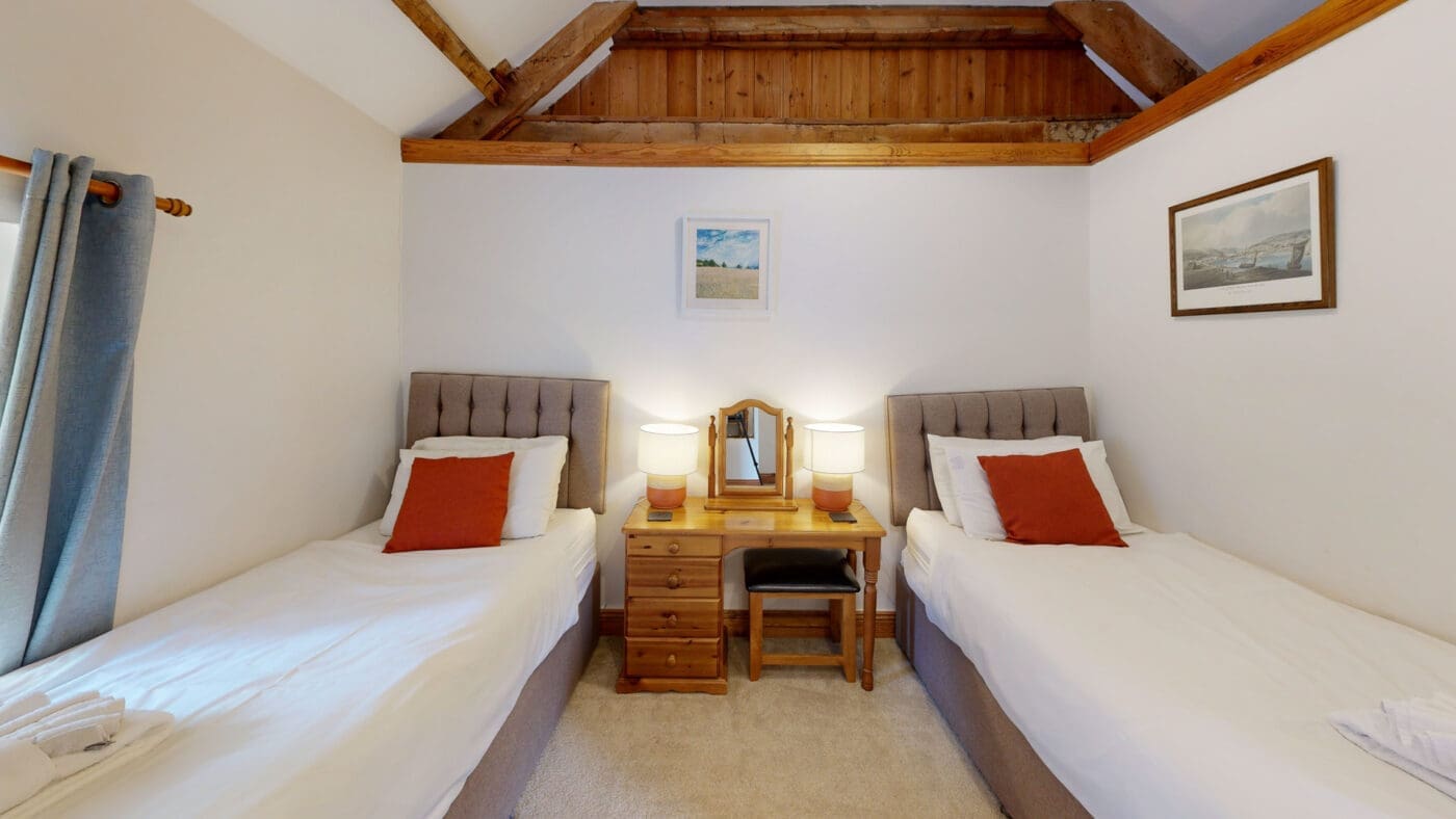 Twin bedroom with exposed beams 