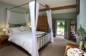 Y Stabl Four Poster Bedroom near Gower Peninsula Gower Cottages
